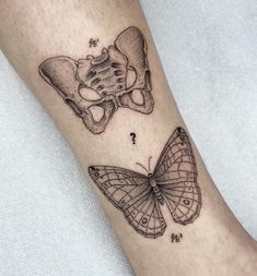 a butterfly tattoo on the left forearm and right leg, with butterflies flying around it