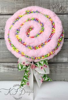 a candy lollipop on top of a wooden table