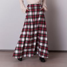 White plaid skirt: - Side seam pockets - Hidden zipper on the back - Lined belted part - Classic tartan pattern - Fabric is 40% wool, 58% polyviscose, 2% of elastane Model is 6'2'', she wears US 8 size US 0  Bust 82 cm (32.5 inches) Waist 64 cm (25 inches) Hips 89 cm (35 inches) US 2  Bust 85 cm (33.5 inches) Waist 66 cm (26 inches) Hips 92 cm (36 inches) US 4  Bust 88 cm (34.5 inches) Waist 68 cm (27 inches) Hips 94 cm (37 inches)  US 6  Bust 90 cm (35.5 inches) Waist 71 cm (28 inches) Hips 96 cm (38 inches)  US 8  Bust 93 cm (36.5 inches) Waist 74 cm (29 inches) Hips 99 cm (39 inches) US 10  Bust 95 cm (37.5 inches) Waist 76 cm (30 inches) Hips 102 cm (40 inches) US 12  Bust 99 cm (39 inches) Waist 80 cm (31.5 inches) Hips 105 cm (41.5 inches) US 14  Bust 103 cm (40.5 inches) Waist 84 cm Plaid Lined Skirt For Winter, Plaid Skirt With Pockets For Winter, Plaid Full Skirt With Lining, Scottish Plaid Skirt For Fall, Scottish Plaid Skirt For Winter, Scottish Style Plaid Skirt For Fall, Winter Scottish Plaid Skirt, Scottish Style Plaid Winter Bottoms, Fall Scottish Plaid Skirt