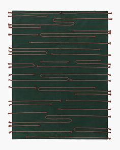 a green rug with red lines on it