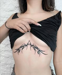 a woman with a tattoo on her stomach