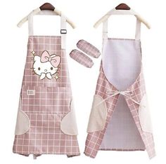 two aprons with hello kitty on the front and one has an oven mitt