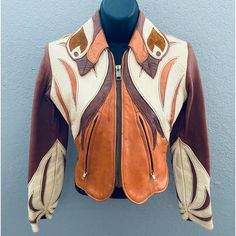 Like The One Worn By Sophia (Britt Robertson) In Girlboss! This Parrot (Named And Numbered On The Leather Original Tag) Hippie, Rocker Leather Jacket Is One Of The Holy Grails Of Fine Vintage Clothing. East West Musical Instruments Has Some Of The Greatest Leather Jackets Ever Made, And This Is Probably Their Most Iconic Design. Own A Piece Of Legendary Fashion Art. Very Few Of These Even Around Anymore. Gorgeous Mixture Of Cream, Orange, And Brown, With The Classic Parrot Collar Measurements: Pit To Pit: 18” Length: 17-19” From Base Of Back Collar To Bottom Hem, 17” In The Middle Of The Back, 19” To The Sides Of That. Sleeve: From Shoulder Seam To Cuff 22 1/4” Sleeve: From Pit To Jumpsuit Men, Western Jacket, Chic Leather, East West, Street Fashion Men Streetwear, 70s Fashion, Mens Streetwear, Musical Instruments, Soft Leather