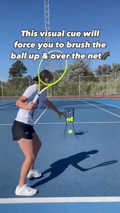 a woman holding a tennis racquet on top of a tennis court with the words, this visual cue will force you to brush the ball up & over the net