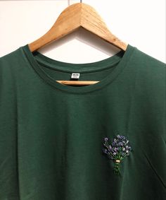 Embroidery DIY T Shirt Pocket Embroidery Ideas, Embroidery On Green Shirt, Green Sweatshirt Embroidery, Lavender Embroidery Shirt, Green Shirt Embroidery, Embroidery On Dark Green Fabric, Embroidery On Tee Shirts, Small Embroidery Designs On Tshirt, Embroidery Designs Crewneck