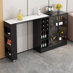 a black and white cabinet with wine bottles on it