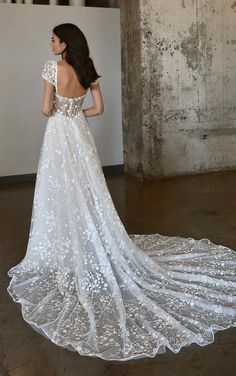 a woman in a wedding dress looking back