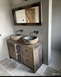 a bathroom with two sinks and a mirror