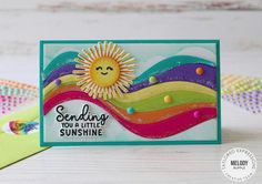 a handmade card with the words sending you a little sunshine and a smiling sun