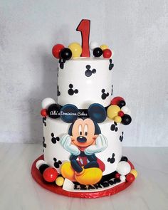 a mickey mouse birthday cake with the number one on it