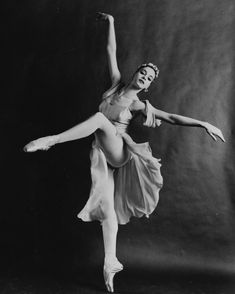 a black and white photo of a ballerina