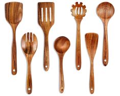 wooden utensils are lined up against a white background