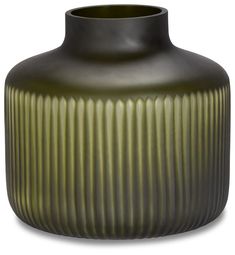 a large green vase sitting on top of a white table