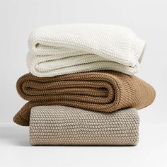 three blankets stacked on top of each other