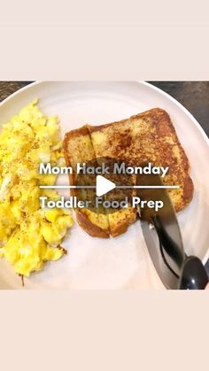 a white plate topped with toast and scrambled eggs