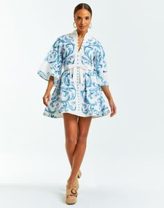 If you are larger in the bust, we recommend sizing up 1 size from your normal size | Blue and white printed linen mini dress with mandarin collar | Functioning button closure with bow detail | Hand pockets at side seam | Zipper closure at side seam | Fully lined | Printed linen Body: 55% linen, 45% Cotton; Lining: 100% Cotton Machine wash gentle cycle on cold or dry clean Model Height: 5’9.5” Dress length: 34" Spain Summer Outfit, Cute Dressy Outfits, Fisher Island Miami, Bid Day Outfits, Allison Bornstein, Engagement Photo Dress, Wedding Wardrobe, Linen Mini Dress, Daytime Dresses