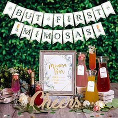 an advertisement for a bar with flowers and bottles on the table in front of it