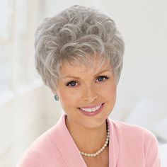 A customer favorite. Easy, no-fuss, short curls the way you like them. This shake-out-and-wear wig is easy to style and needs minimal upkeep. Comfortable feather-lite construction and Velcro® tabs adjust sizing up to 5. Choose from 3 sizes and large selection of natural looking colors. Cap Sizes: Petite, Average, Large Front: 4” Crown: 3½” Sides: 2½” Back: 2½” Nape: 2” Weight: 2.12 oz. Save when purchased with a wig: (#8636) Wig Care Shampoo only $6 each (#7459) Our Wig Hugger which makes the w Short Permed Hair, Short Silver Hair, Wigs Short, Short Curly Wigs, Mom Hairstyles, Short Hair Over 60