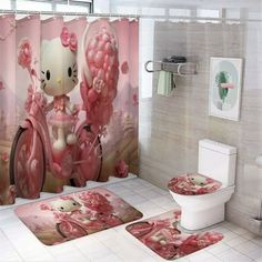 the bathroom is decorated in pink and has hello kitty shower curtains, rugs, and toilet paper