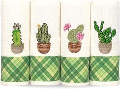 three towels with cactus designs on them are lined up in front of each other, one is green and the other has pink flowers