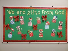 we are gifts from god bulletin board with bows and presents on green paper, hanging on the wall