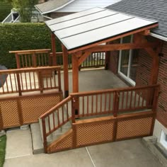 a wooden gazebo sitting on top of a patio