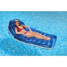 a woman laying on an inflatable pool float