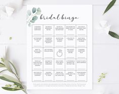 a printable bridal bingo game with eucalyptus leaves and greenery on the side