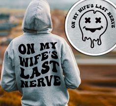 a person wearing a sweatshirt with the words on my wife's last nerve