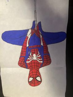 a drawing of a spider man hanging from a ceiling