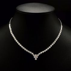 She'll never tire of wearing this classic and sophisticated diamond tennis necklace. Stunning in 18K solid white gold, this breathtaking line of shimmering round diamonds. So elegant, this 18.0-inch diamond necklace will take her breath away. Radiant with 3.08 cts. t.w. of diamonds and buffed to a brilliant luster, this glamorous keepsake secures with a box clasp. The setting design make the diamonds look much bigger than they are. When worn, the diamonds look like 1/5 carat each. Diamonds Detai Luxury Diamond White Diamond Necklace For Party, Luxury Diamond White Solitaire Necklace For Anniversary, Luxury Diamond White Diamond Necklace Hallmarked, Luxury White Gold Diamond Necklace With Round Stone, Luxury Diamond White Round Cut Bridal Necklace, Luxury White Gold Necklace With Single Cut Diamonds, Luxury Diamond White Necklace For Celebration, Luxury Single Cut Diamond Bridal Necklace, Luxury Diamond Necklace With Diamond Eyes For Wedding