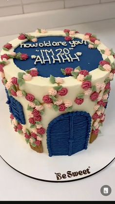 a birthday cake decorated with flowers and the words happy birthday on it's side