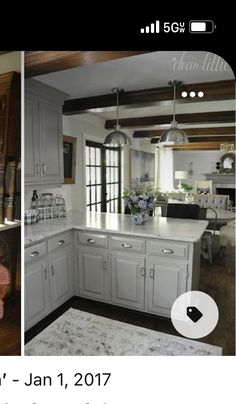 an instagram photo of a kitchen with white cabinets and wood floors in the background