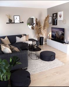 a living room filled with furniture and a flat screen tv