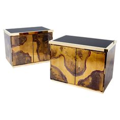 two pieces of art deco furniture made out of wood and metal, each with an abstract design