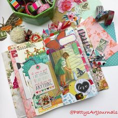 an open scrapbook with lots of crafting supplies