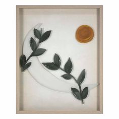 a shadow box with leaves and a sun in the middle, on a white background