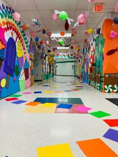 the hallway is decorated with bright colors and paper decorations