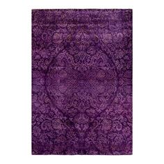 a purple rug with an intricate design on the front and back side, in various colors