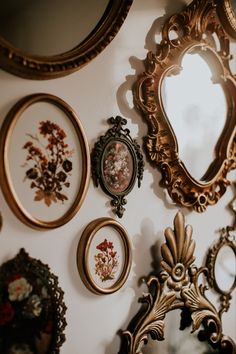 there are many ornate mirrors on the wall