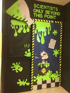 a door decorated with green and black paint