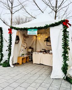 a white tent with christmas decorations on it