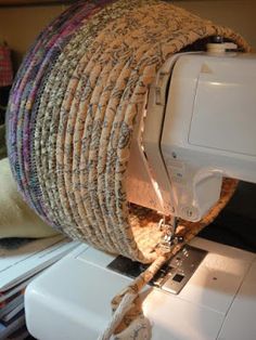 a white sewing machine sitting on top of a table