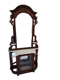 an antique wooden mirror and shelf with white cloth on it's top, against a white background