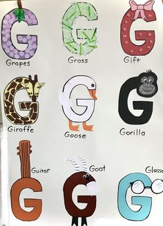 a white sign with different letters and animals on it's side, including giraffe, gorilla, g, giraffe, giraffe, giraffe