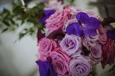 a bridal bouquet with purple and pink flowers