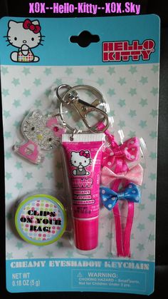 a hello kitty keychain with a tube of toothpaste and a bow