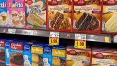 the shelves in a store are filled with different types of cakes and desserts for sale