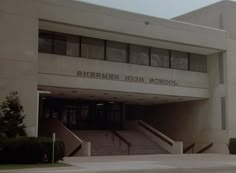 the front entrance to sherman high school with stairs leading up and down it's side