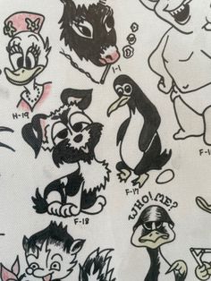 an image of various cartoon characters drawn on paper